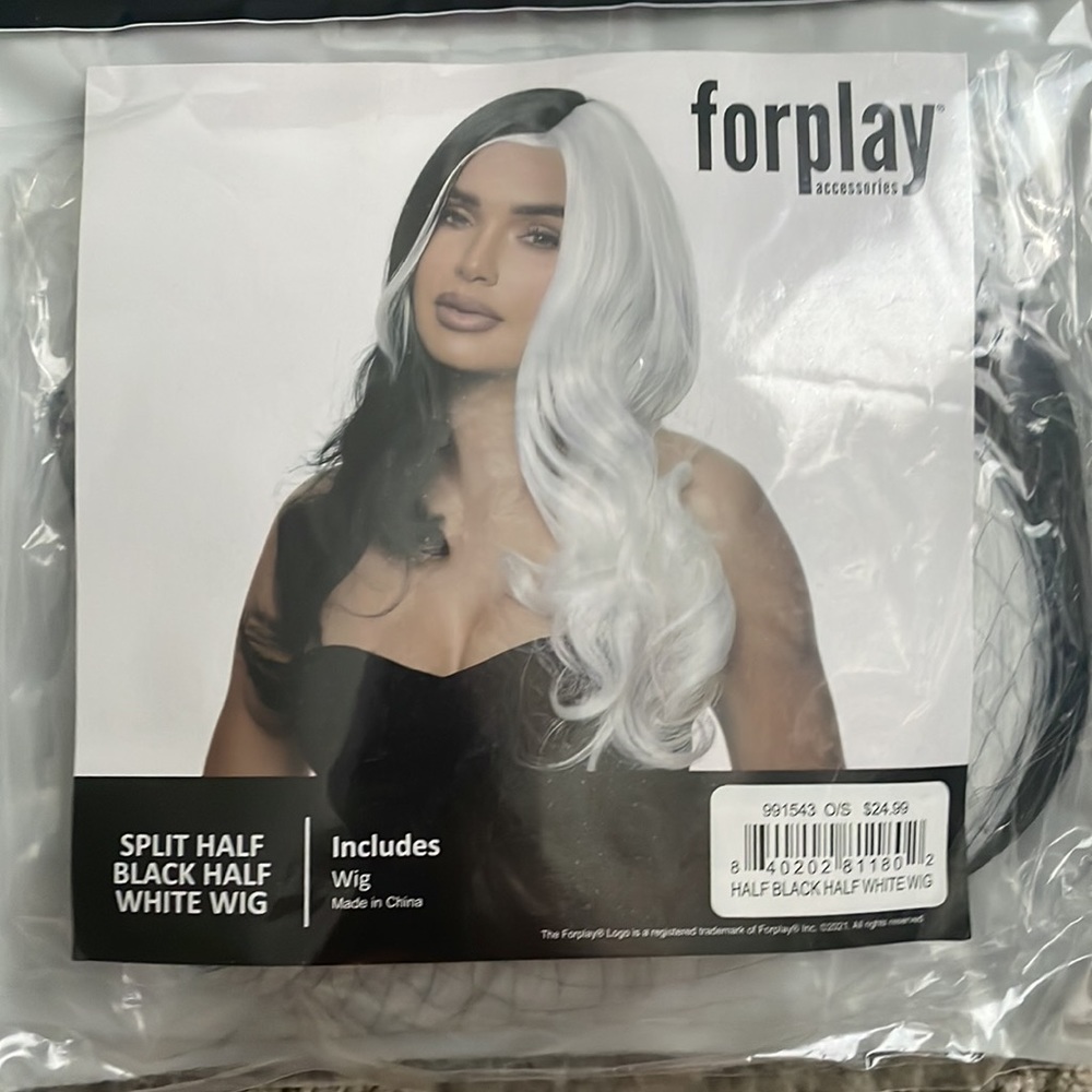 Brand new unworn black and white wig!